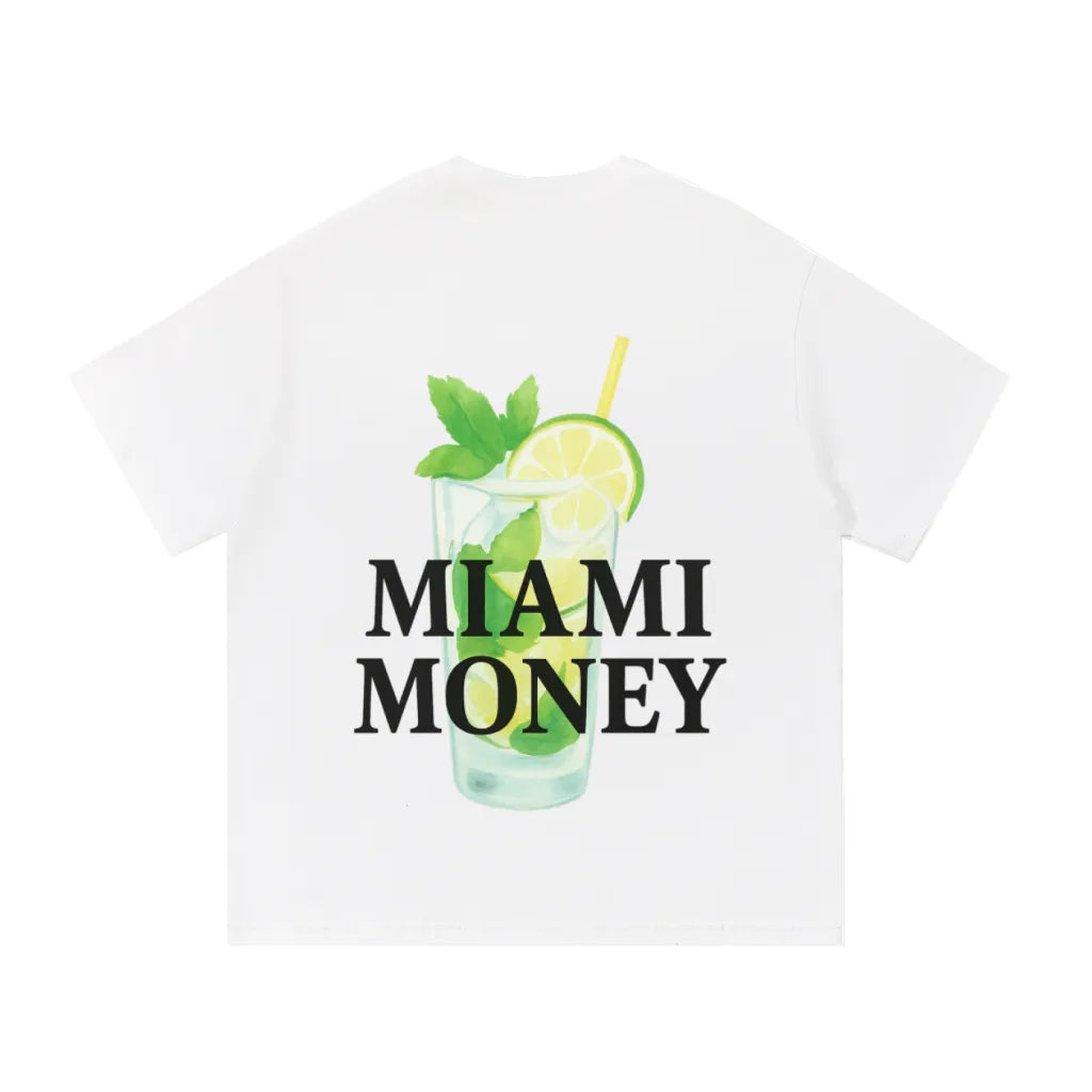 Miami Money white t-shirt featuring a bold black “MIAMI MONEY” logo layered over a mint mojito cocktail illustration—clear glass with lime slices, fresh mint leaves, and a yellow straw—minimalist summer streetwear graphic on a clean white background.